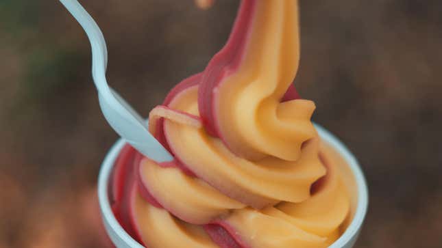 Close-up of Dole Whip in cup with spoon protruding from it