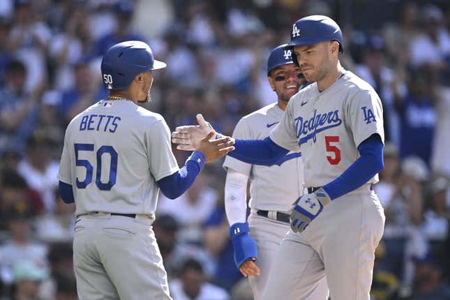 Aug 6, 2023; San Diego, California, USA; Los Angeles Dodgers first baseman Freddie Freeman (5) is congratulated by right fielder Mookie Betts (50) after hitting a two-run home run during the second inning against the San Diego Padres at Petco Park.