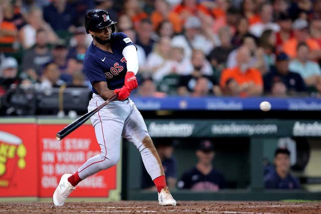 Aug 24, 2023; Houston, Texas, USA; Boston Red Sox shortstop Pablo Reyes (19) hits an RBI single against the Houston Astros during the third inning at Minute Maid Park.