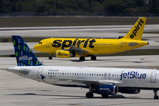  JetBlue Airlines plane near a Spirit Airlines plane at the Fort Lauderdale-Hollywood International Airport on May 16, 2022 in Fort Lauderdale, Florida. 
