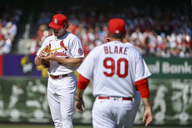 Mar 30, 2023; St. Louis, Missouri, USA;  St. Louis Cardinals starting pitcher Miles Mikolas (39) stands on the mound as pitching coach Dusty Blake (90) walks out during the first inning against the Toronto Blue Jays at Busch Stadium.