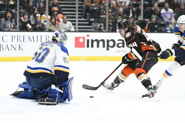 Mar 25, 2023; Anaheim, California, USA; St. Louis Blues goalie Jordan Binnington (50) blocks the goal while Anaheim Ducks left wing Max Comtois (44) closes in during first period at Honda Center.