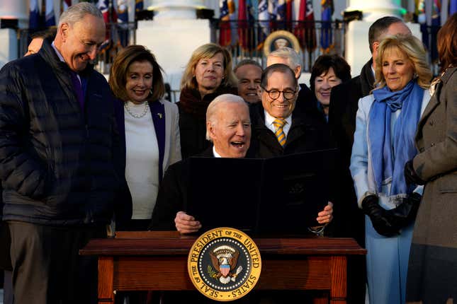 U.S. President Joe Biden signs the Respect for Marriage Acton during a ceremony on the South Lawn of the White House in Washington on December 13, 2022.