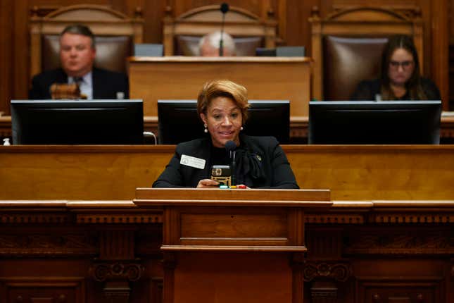 Rep. Mesha Mainor, D-Atlanta, center, speaks in favor of HB 231 in the House chambers during crossover day at the Georgia State Capitol, Monday, March 6, 2023, in Atlanta. 