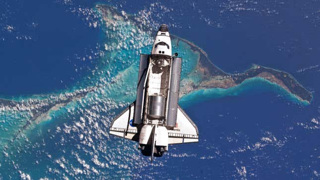 The Space Shuttle Atlantis orbits Earth