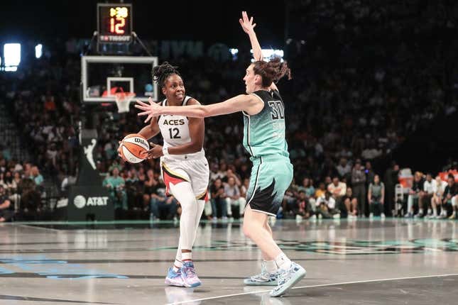 Aug 6, 2023; Brooklyn, New York, USA; Las Vegas Aces guard Chelsea Gray (12) is guarded by New York Liberty forward Breanna Stewart (30) in the third quarter at Barclays Center.