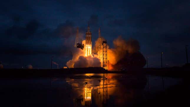 A photo of a Delta IV rocket launching at night. 