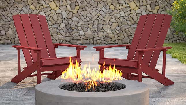 Two Adirondack chairs outside by a fire pit.