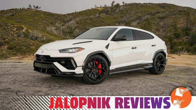 A white 2023 Lamborghini Urus Performante is parked in front of hills.