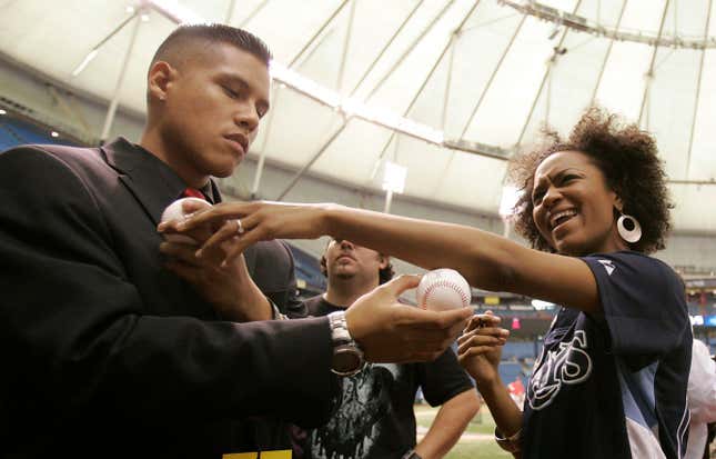 Syesha Mercado, right, after singing national anthem at Tampa Bay Rays game in 2008.