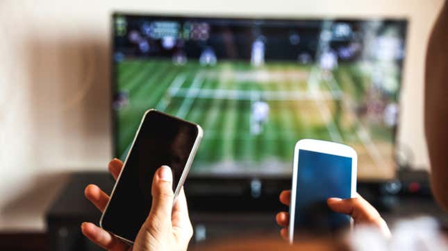 Watching sports on phone.
