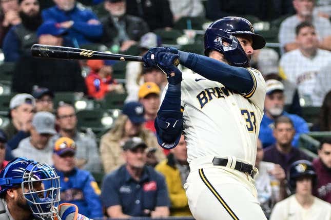 Apr 5, 2023; Milwaukee, Wisconsin, USA; Milwaukee Brewers designated hitter Jesse Winker (33) hits a double to drive in two runs in the fifth inning against the New York Mets at American Family Field.