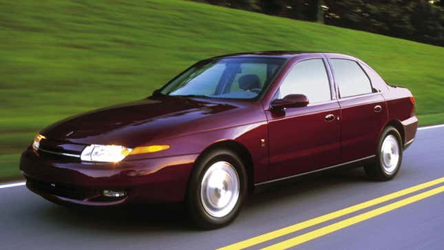 A photo of a burgundy Saturn L Series sedan. 