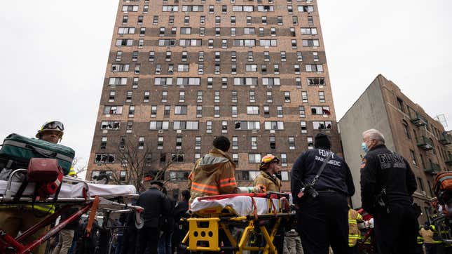 Emergency personnel work at the scene of a fatal fire at an apartment building in the Bronx on Sunday, Jan. 9, 2022, in New York. 