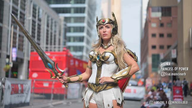 A cosplayer dressed as She-Ra princess of power wields a sword outside Fan Expo Canada.