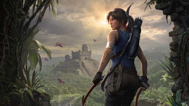 Lara Croft standing in front of an entryway overlooking a pyramid.