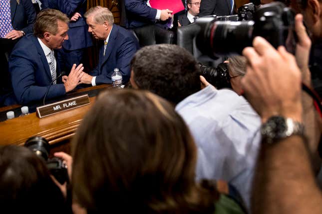 Flake speaks with Graham at the conclusion of the session.