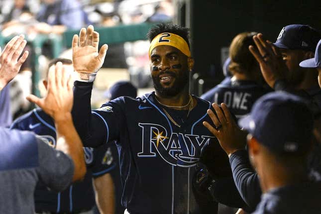 Apr 4, 2023; Washington, District of Columbia, USA; Tampa Bay Rays first baseman Yandy Diaz (2) is congratulated by teammates after scoring a run during the eighth inning against the Washington Nationals at Nationals Park.