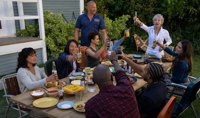 the cast all around a table.