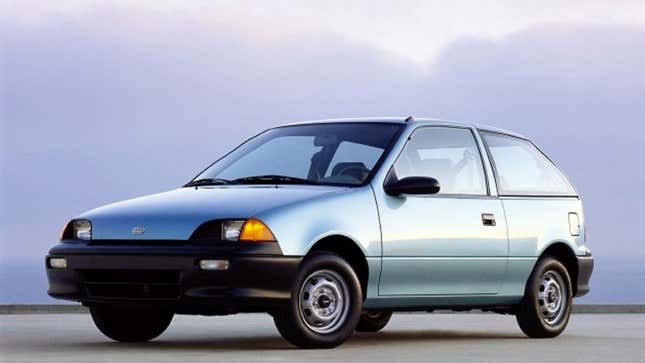 A photo of a pale blue Geo Metro hatchback. 