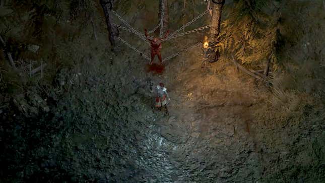 A Diablo IV Necromancer is standing in front of skinless Feodor, who is suspended by chains.