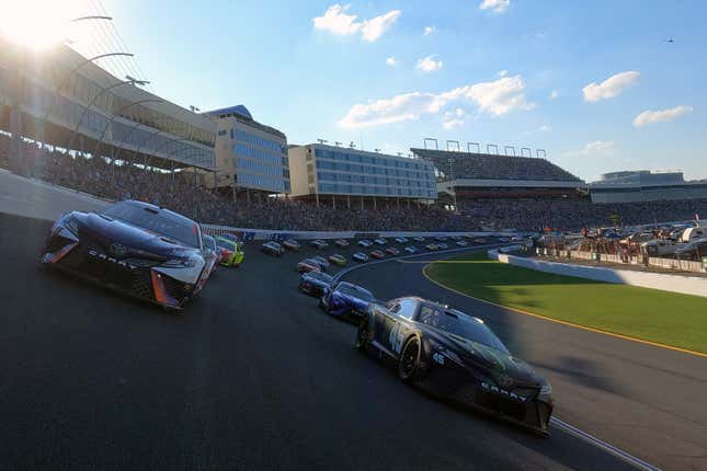 Denny Hamlin, driver of the No. 11 FedEx Ground Toyota, and Kurt Busch, driver of the No. 45 Monster Energy Toyota, lead the field prior to the green flag of the NASCAR Cup Series Coca-Cola 600 at Charlotte Motor Speedway on May 29, 2022 in Concord, North Carolina.