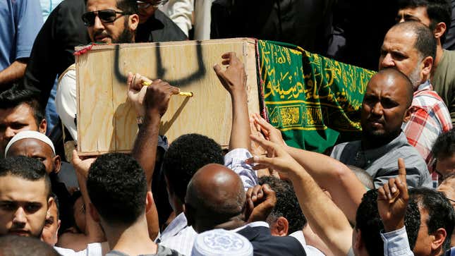Mourners carry the casket of Abdirahman Abdi during his funeral on July 29.