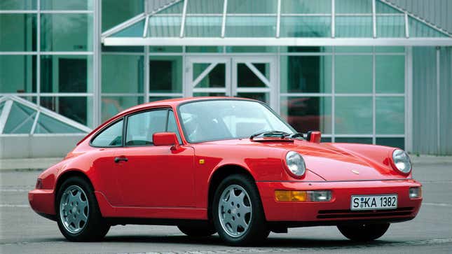 A photo of a red Porsche 911 from the 1980s. 