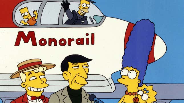 A promo image shows Homer and Bart in a monorail trail above Marge and others. 