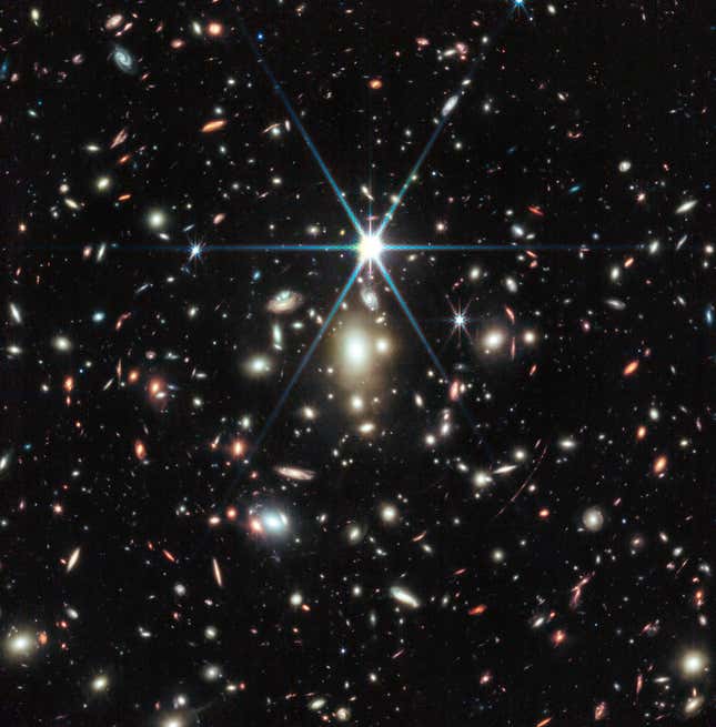 The massive galaxy cluster WHL0137-08. Note the gravitational lensing.