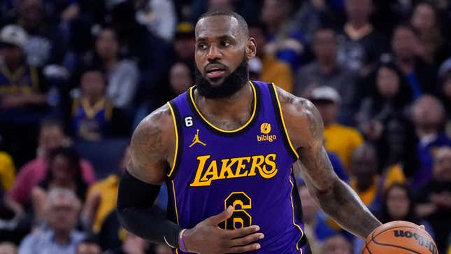 Los Angeles Lakers forward LeBron James dribbles up the court during the second half of an NBA basketball game against the Golden State Warriors in San Francisco, Tuesday, Oct. 18, 2022.