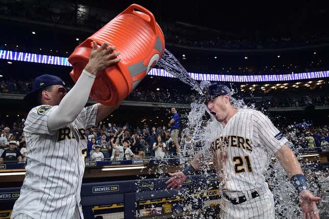 Sep 16, 2023; Milwaukee, Wisconsin, USA;  Milwaukee Brewers left fielder Mark Canha (21) gets dunked by shortstop Willy Adames (27) after beating the Washington Nationals at American Family Field.