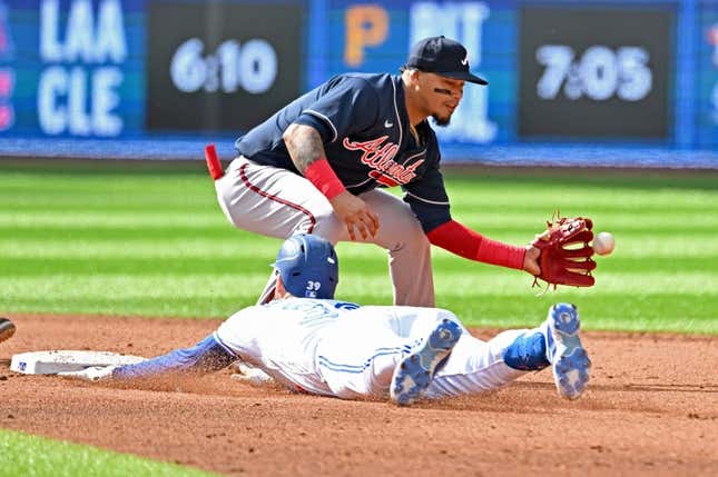 May 13, 2023; Toronto, Ontario, CAN; Toronto Blue Jays center fielder Kevin Kiermaier (39) slides safely into second base with a double as Atlanta Braves shortstop Orlando Arcia (11) takes the throw in the fifth inning at Rogers Centre.