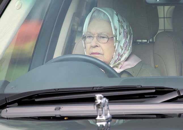 Her Royal Highness Queen Elizabeth II driving her Range Rover, with signature Labrador hood ornament, at the Royal Windsor Horse Show in May 2017.