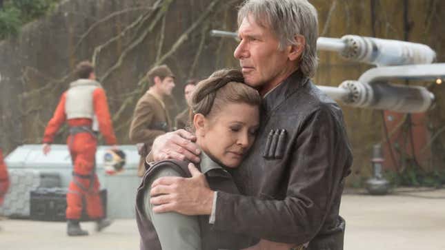 Han and Leia share an embrace in Star Wars: The Force Awakens.