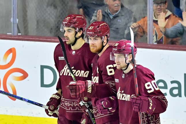 Mar 16, 2023; Tempe, Arizona, USA;  Arizona Coyotes left wing Lawson Crouse (67) celebrates with defenseman J.J. Moser (90) and center Jack McBain (22) after scoring a goal in the third period against the Vancouver Canucks at Mullett Arena.