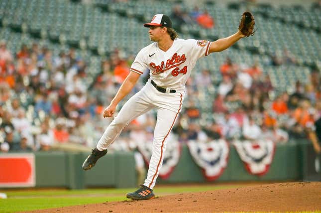 Apr 12, 2023; Baltimore, Maryland, USA;  Baltimore Orioles starting pitcher Dean Kremer (64) throws a first inning pitch against the Oakland Athletics at Oriole Park at Camden Yards.