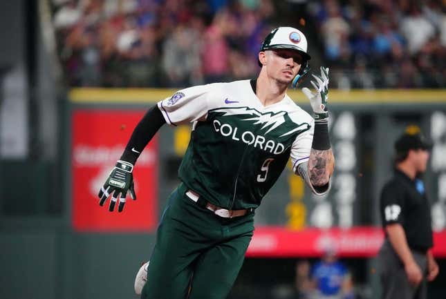 Sep 2, 2023; Denver, Colorado, USA; Colorado Rockies center fielder Brenton Doyle (9) runs the bases after hitting a three run triple against the Toronto Blue Jays in the fifth inning at Coors Field.