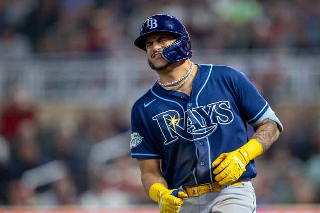 Sep 11, 2023; Minneapolis, Minnesota, USA; Tampa Bay Rays center fielder Jose Siri (22) reacts after getting hit in the hand by a pitch against the Minnesota Twins in the fifth inning at Target Field.