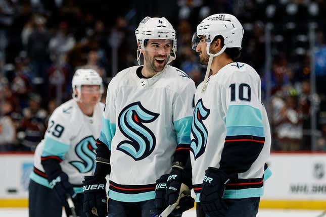 Apr 20, 2023; Denver, Colorado, USA; Seattle Kraken defenseman Justin Schultz (4) and Seattle Kraken center Matty Beniers (10) during warmups before game two against the Colorado Avalanche in the first round of the 2023 Stanley Cup Playoffs at Ball Arena.