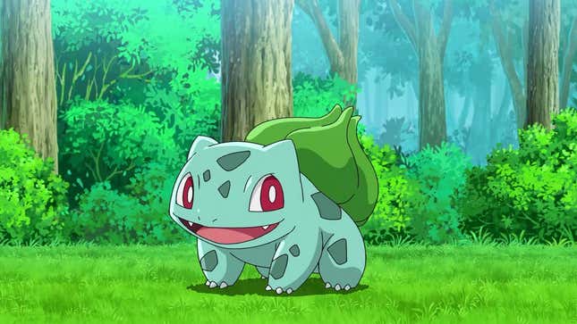 Bulbasaur is seen standing in a forest smiling at the camera.