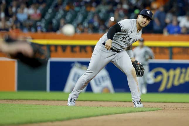 Aug 29, 2023; Detroit, Michigan, USA; New York Yankees shortstop Anthony Volpe (11) makes a throw to first to complete a double play in the seventh inning at Comerica Park.