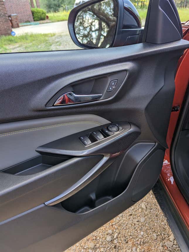 The driver door of the 2024 Chevy Trax highlighting its materials