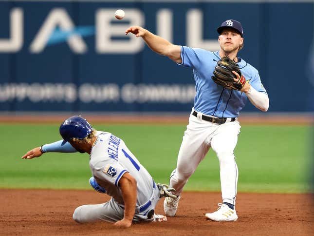 Jun 25, 2023; St. Petersburg, Florida, USA; Tampa Bay Rays second baseman Taylor Walls (6) turns a double play against the Kansas City Royals in the second inning at Tropicana Field.
