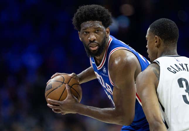 Apr 17, 2023; Philadelphia, Pennsylvania, USA; Philadelphia 76ers center Joel Embiid (21) controls the ball against Brooklyn Nets center Nic Claxton (33) during the third quarter in game two of the 2023 NBA playoffs at Wells Fargo Center.