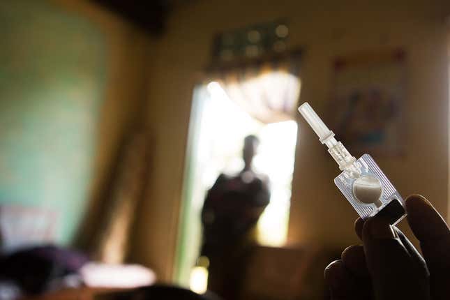 A health worker holds a Sayana Press progestin-only contraceptive before administering it in Kalera Village.