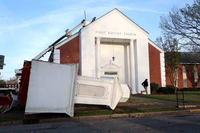 Workers make repairs to the First Baptist Church after it was struck by Friday’s tornado on March 26, 2023 in Rolling Fork, Mississippi.
