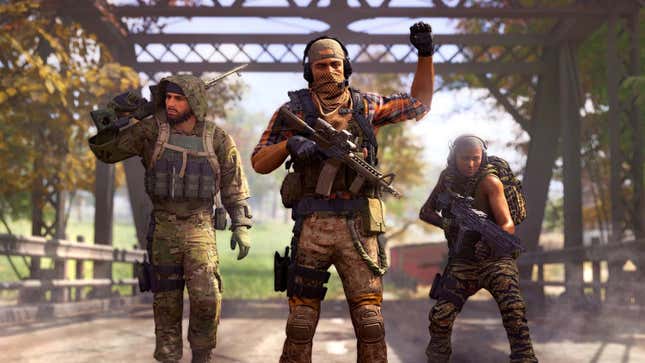 Three operators stand on a bridge carrying guns and other very serious gear. 