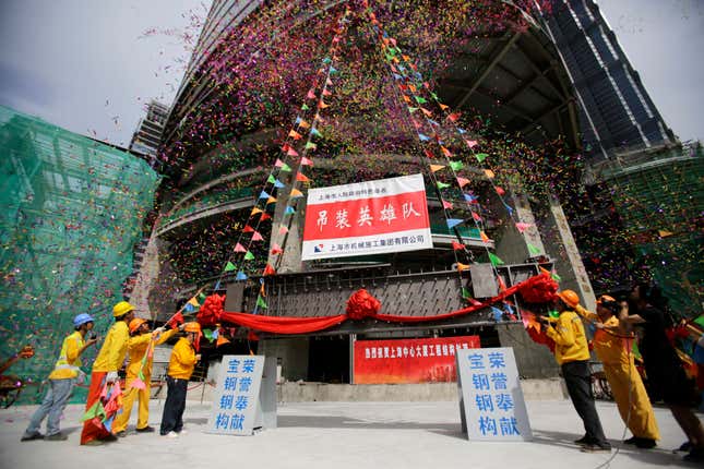 The topping off ceremony for Shanghai Tower on Aug 3.
