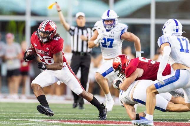 Sep 8, 2023; Bloomington, Indiana, USA; Indiana Hoosiers running back Josh Henderson (26) runs the ball in the first half against the Indiana State Sycamores at Memorial Stadium.